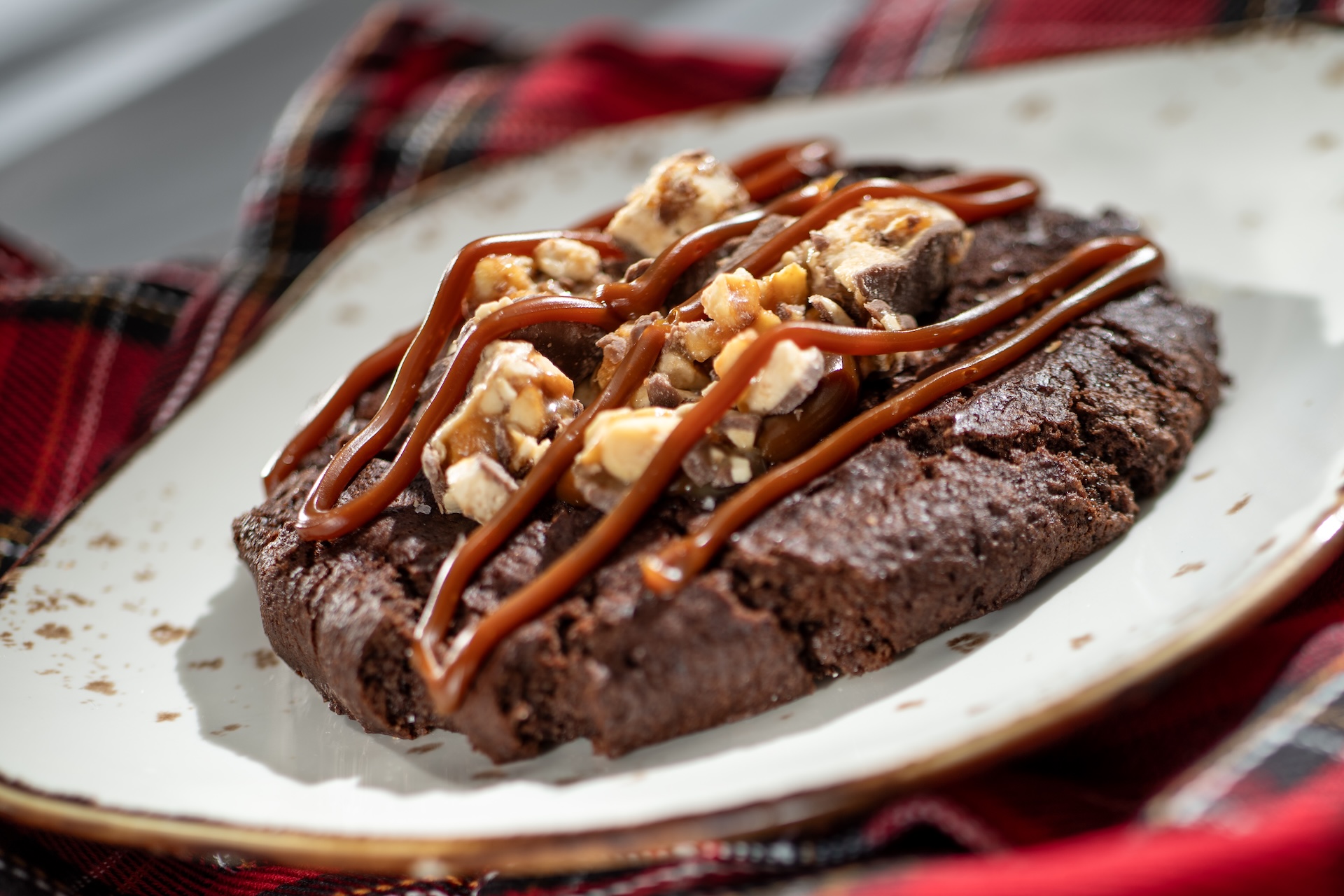 Chocolate Cookie featuring SNICKERS bar pieces and salted caramel (New)