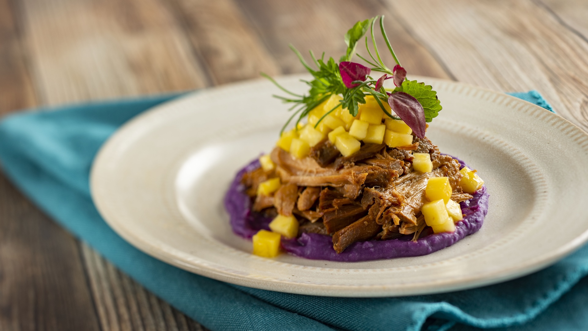 Kālua Pork with coconut, sweet potatoes, and mango salad