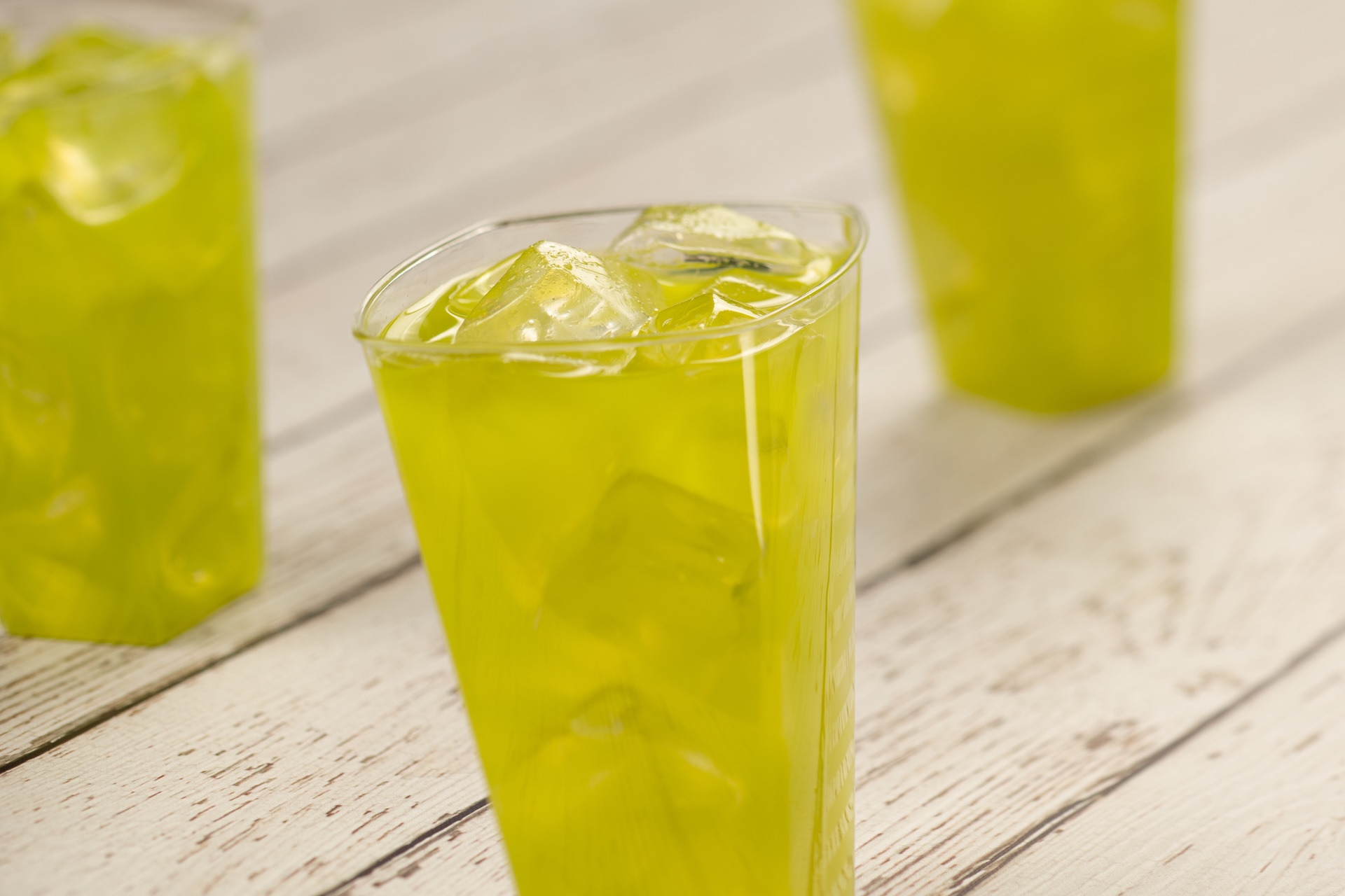 Melon Breeze: DOLE Pineapple Juice, lime juice, melon liqueur, and Sailor Jerry Spiced Rum