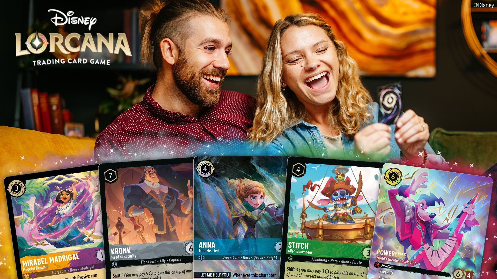 Two friends joyfully play Disney Lorcana trading card game, showcasing colorful cards.