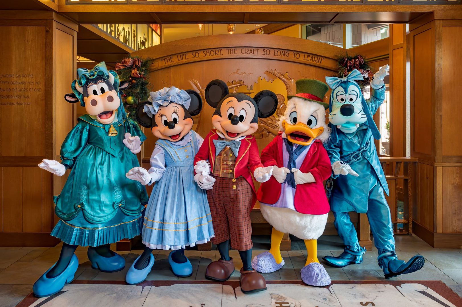 Mickey Mouse and friends in festive costumes at Disneyland.