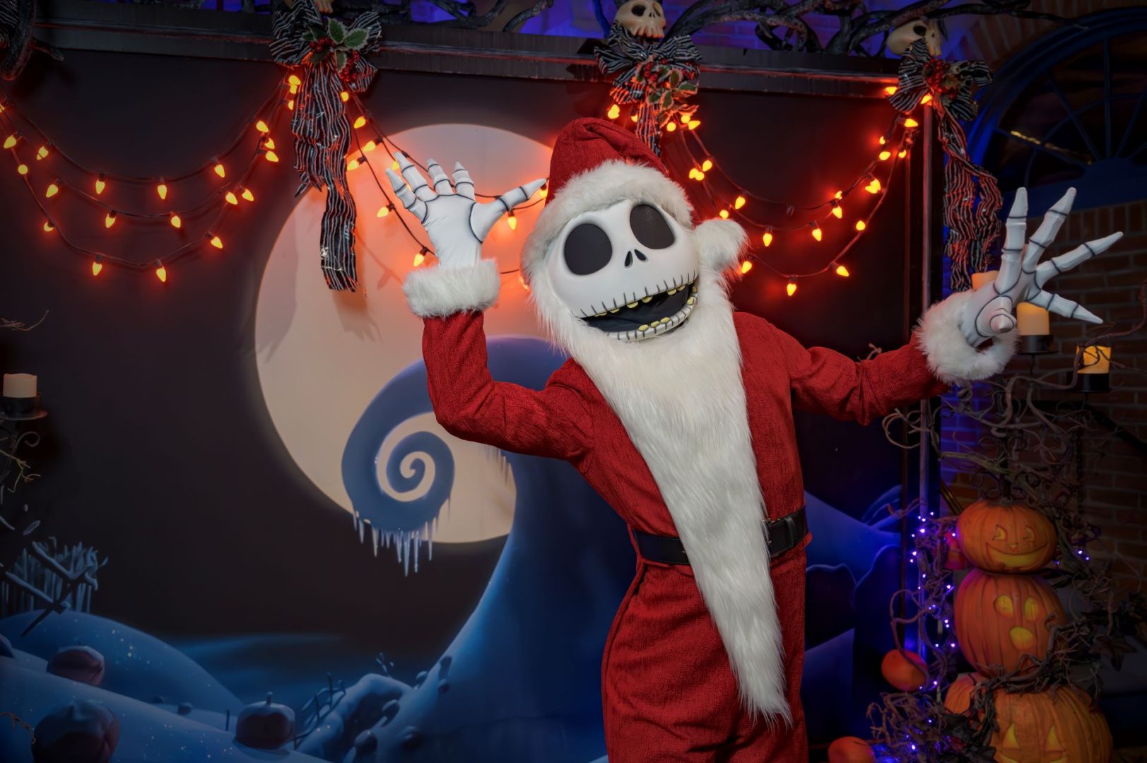Santa Jack Skellington poses cheerfully with festive decorations in the background.