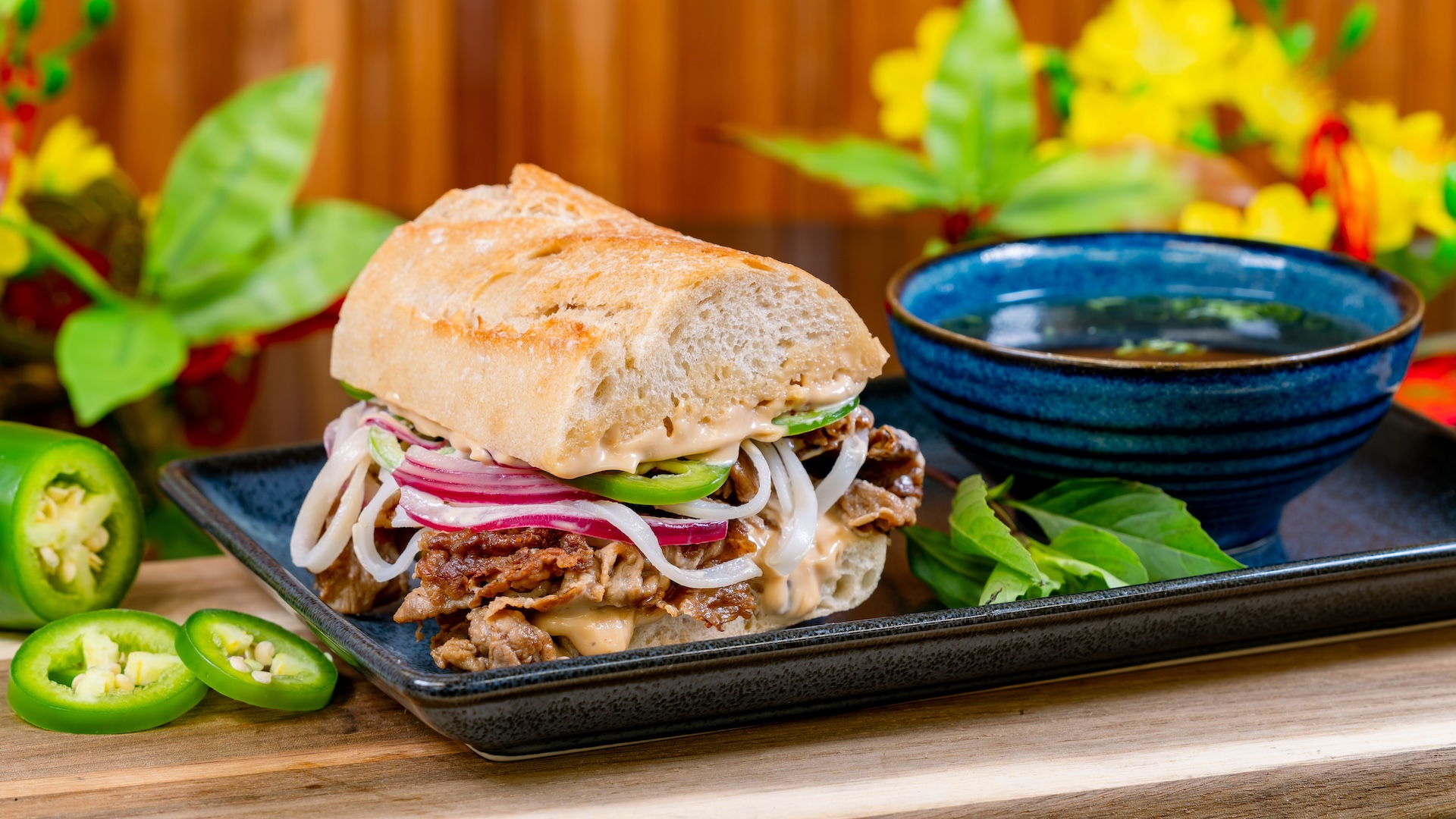 Phở Dip with rice noodles, sliced beef, shaved jalape&ntilde;os, pickled onions, and phở broth