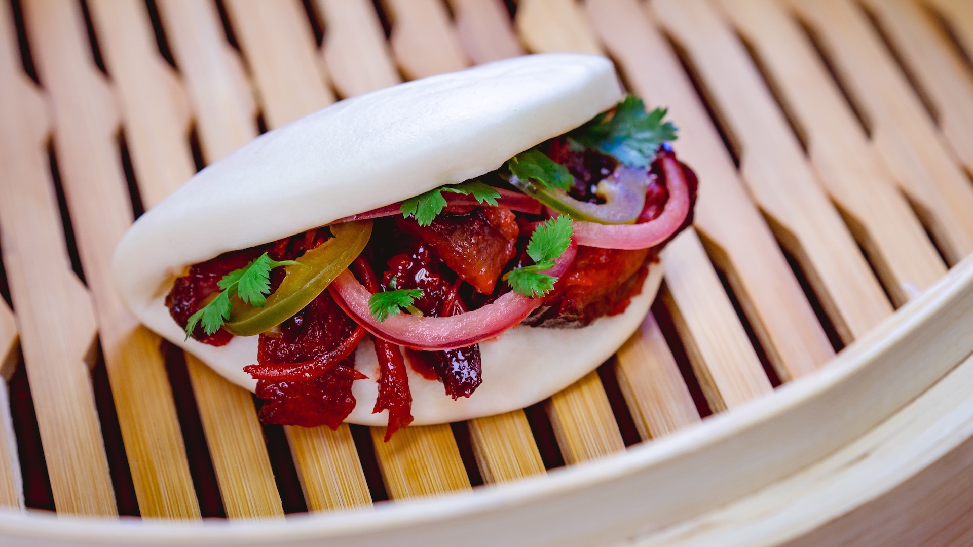 Char Siu BBQ Pork Bao with pickled red onions and jalape&ntilde;o