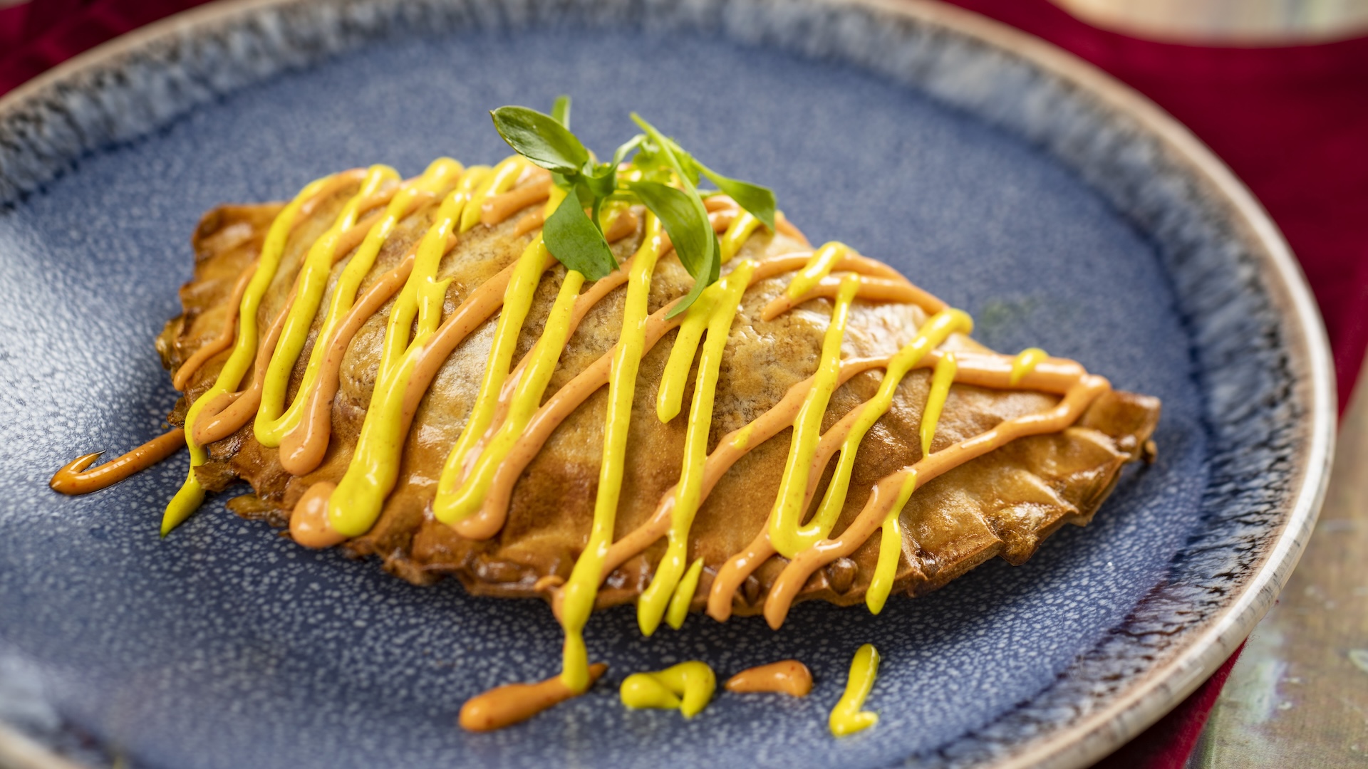 Chorizo and Potato Empanada with turmeric a&iuml;oli and annatto a&iuml;oli