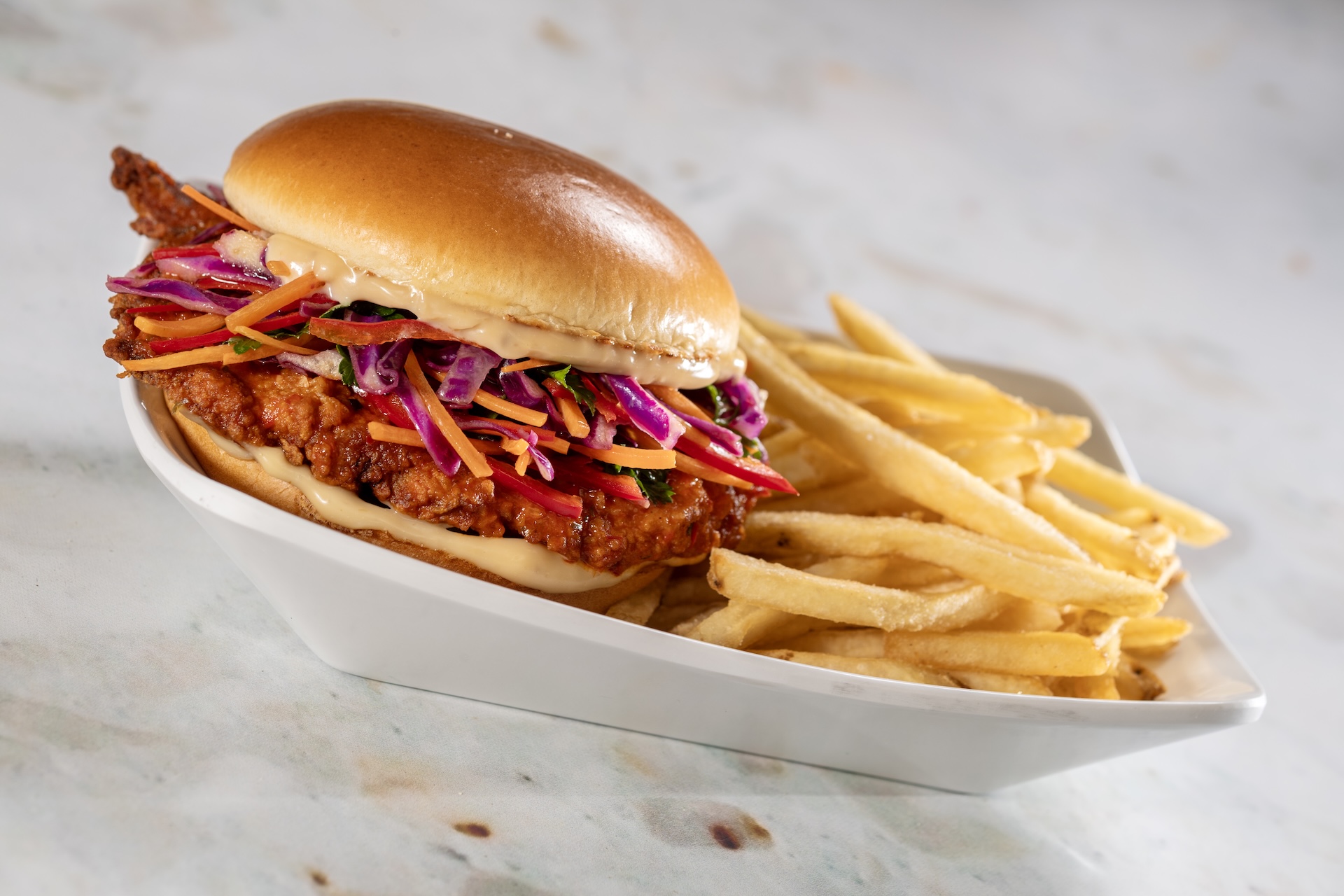 Nashville Hot Chicken Sandwich: Spicy hand-breaded chicken, roasted garlic a&iuml;oli, and southern slaw on a toasted brioche bun (New)
