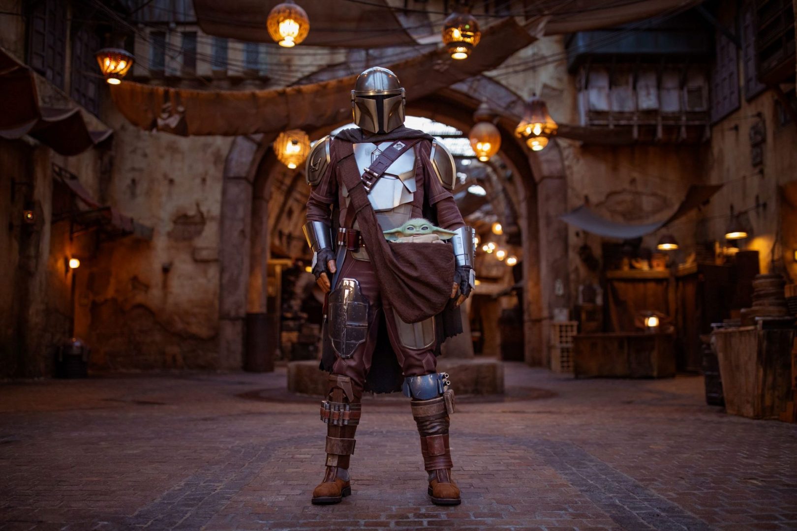 The Mandalorian and Grogu in Star Wars Galaxy's Edge in Disneyland Park
