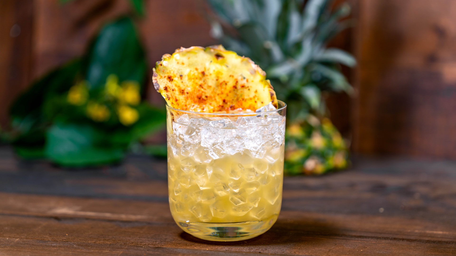 Cantarito-Style Paloma: Reposado tequila, habanero-infused pineapple juice, rock melon syrup, lime juice, and Fresca garnished with a pineapple wheel and Taj&iacute;n seasoning