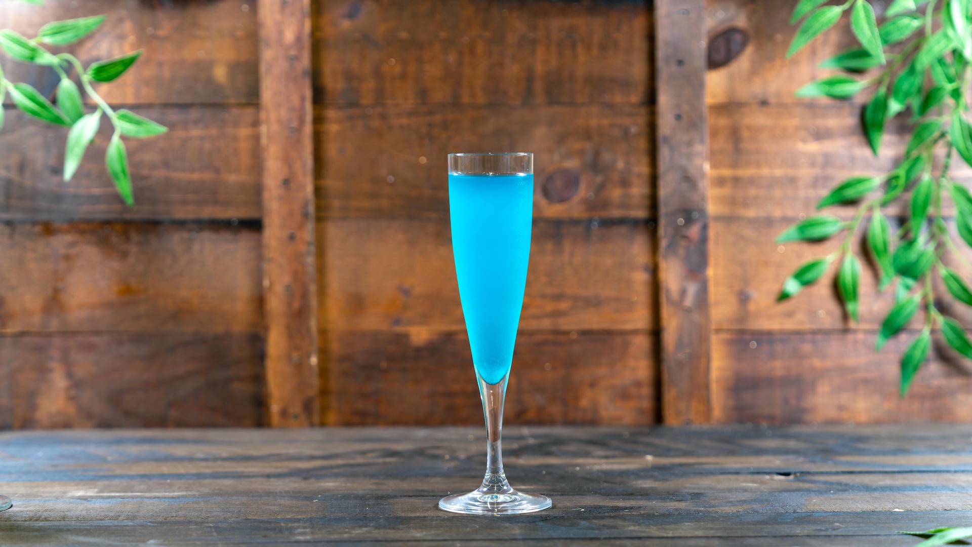 Blue Raspberry Pineapple Mimosa: Sparking wine, blue raspberry syrup, and pineapple juice (New)