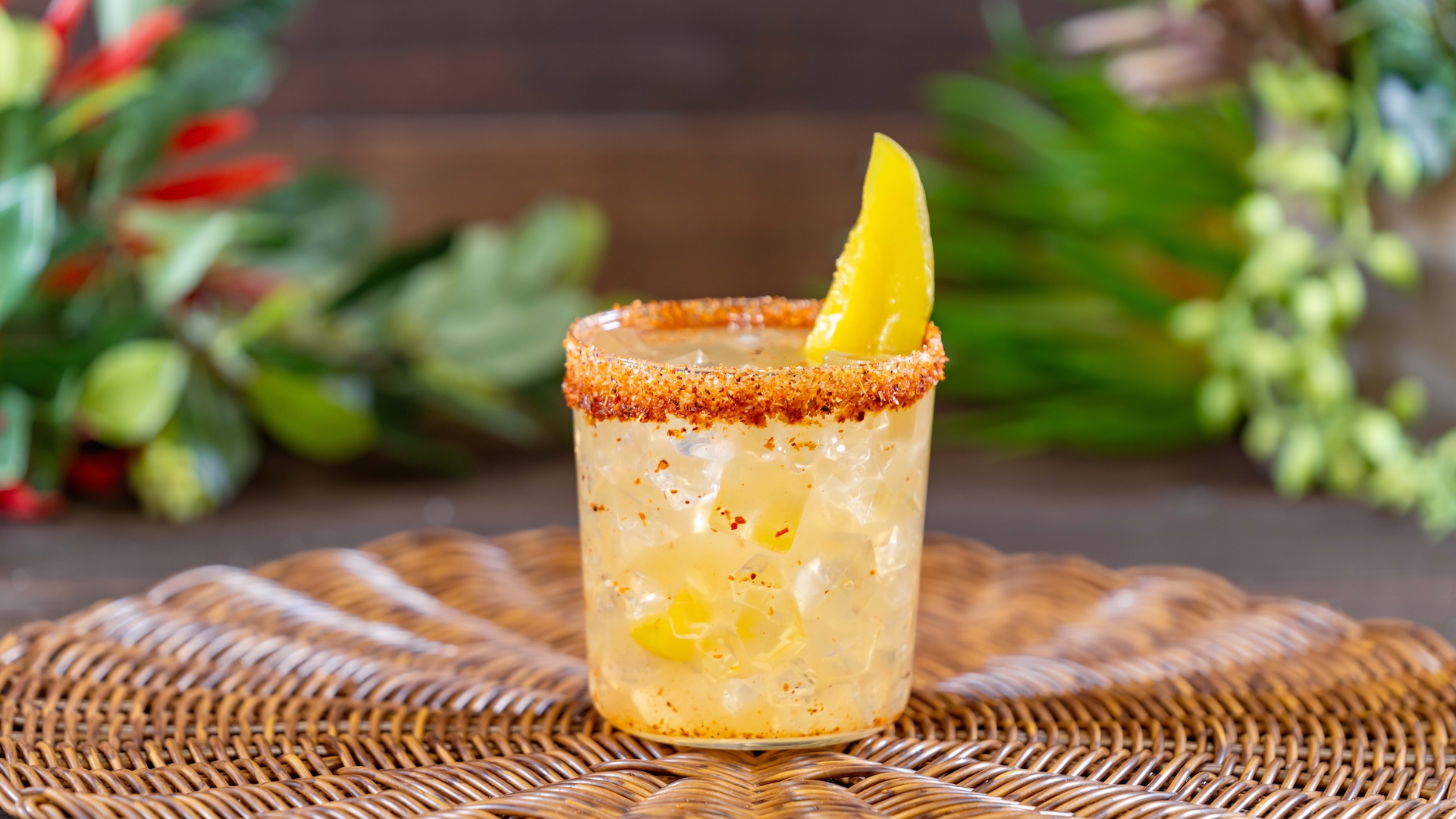 Pickle Whiskey Sour: Bourbon, pickle and lime juices, and sweet and sour rimmed with Taj&iacute;n Cl&aacute;sico and Taj&iacute;n Chile-Lime Sauce and garnished with a pickle spear
