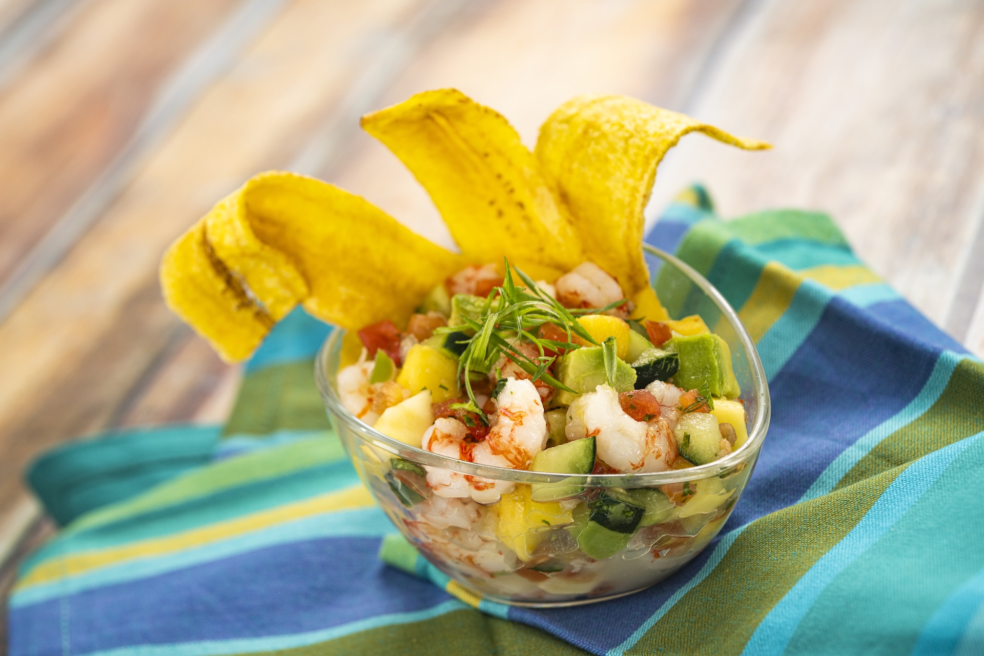 Ceviche: Shrimp with mango, avocado, cucumber, lime, cilantro, tomato, and jalape&ntilde;o served with plantain chips (New)
