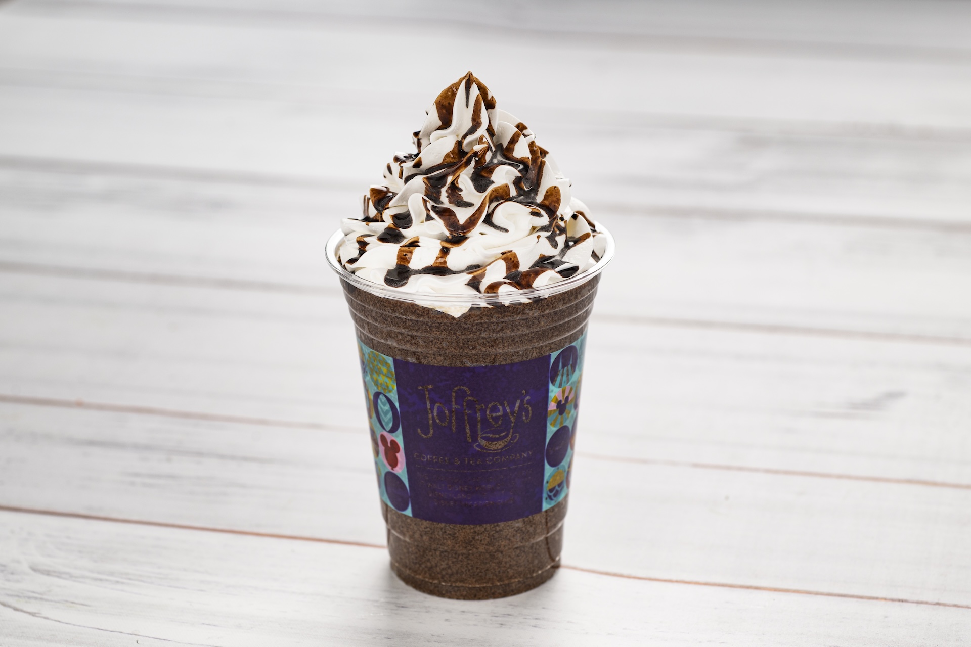 Dubai Chocolate Frozen Cappuccino: Frozen cappuccino featuring Joffrey&rsquo;s Coffee with pistachio syrup topped with whipped cream and dark chocolate sauce (Non-alcoholic) (New) (Spirited version available with Kahl&uacute;a Coffee Liqueur)