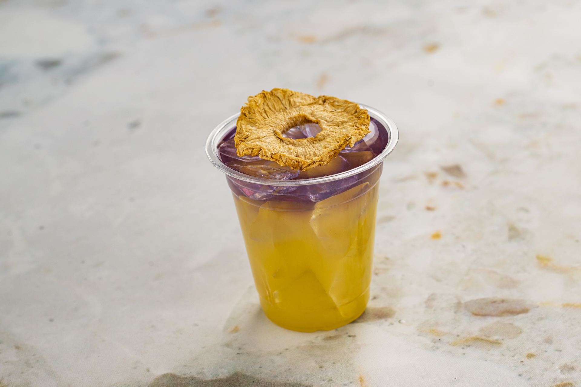 Garden Glimmer: Empress 1908 Gin, DOLE Pineapple Juice, lemon juice, and almond-flavored syrup (New)