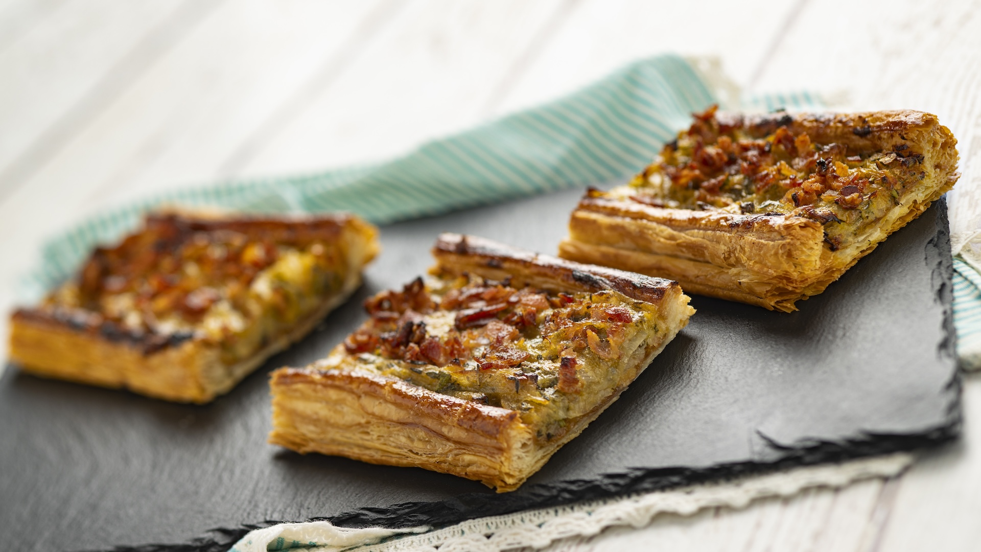Tarte Aux Oignons Caramelises: Caramelized onions on a flaky pastry crust topped with bacon (New)