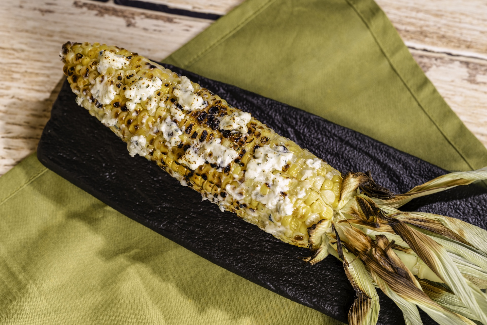 Grilled Street Corn on the Cob with savory garlic spread featuring Boursin Dairy-Free Garlic & Fine Herbs Cheese (Plant-based)