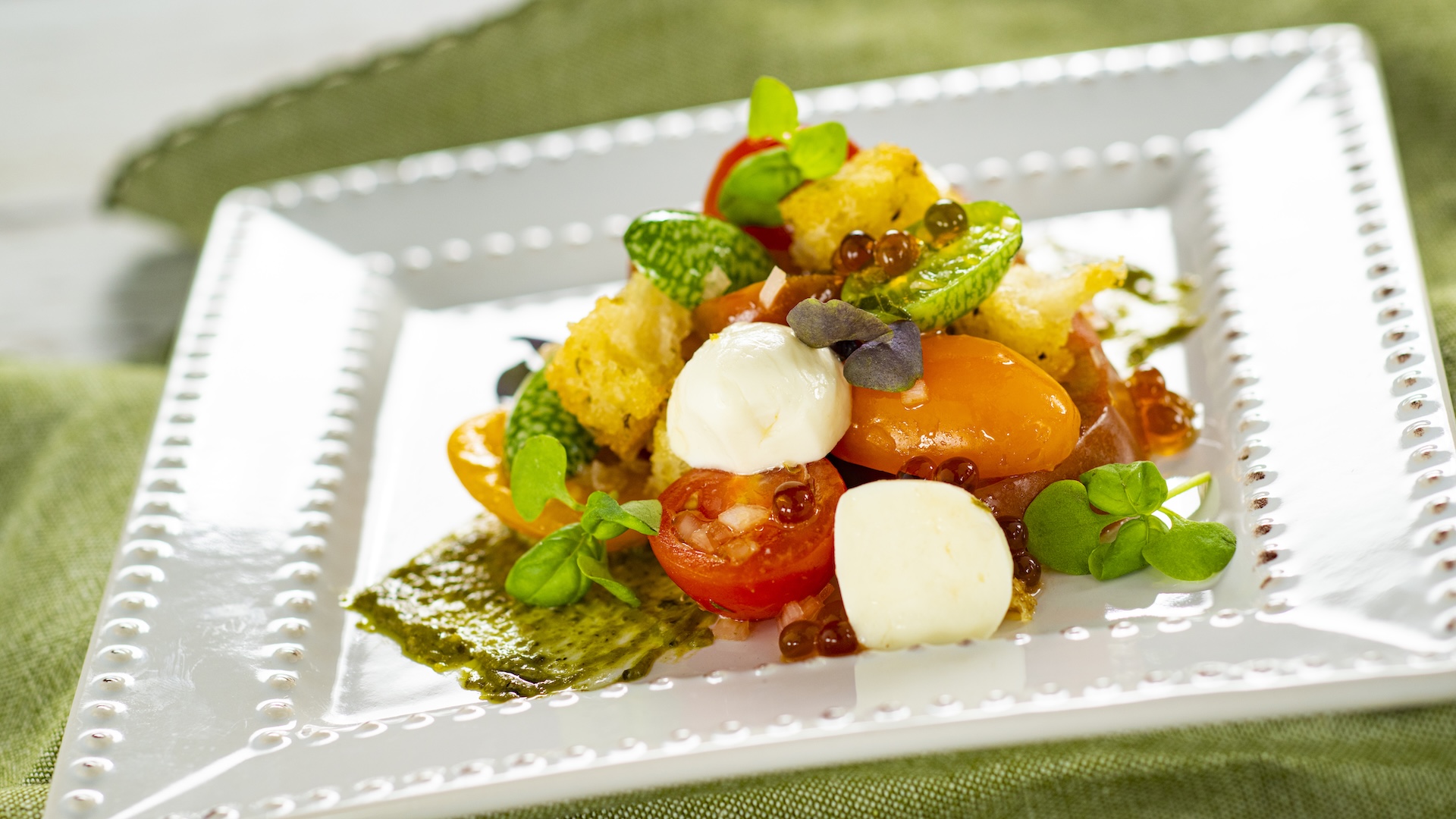 Heirloom Tomatoes and Fresh Mozzarella with shallot vinaigrette, sourdough croutons, pesto, micro basil, and balsamic pearls