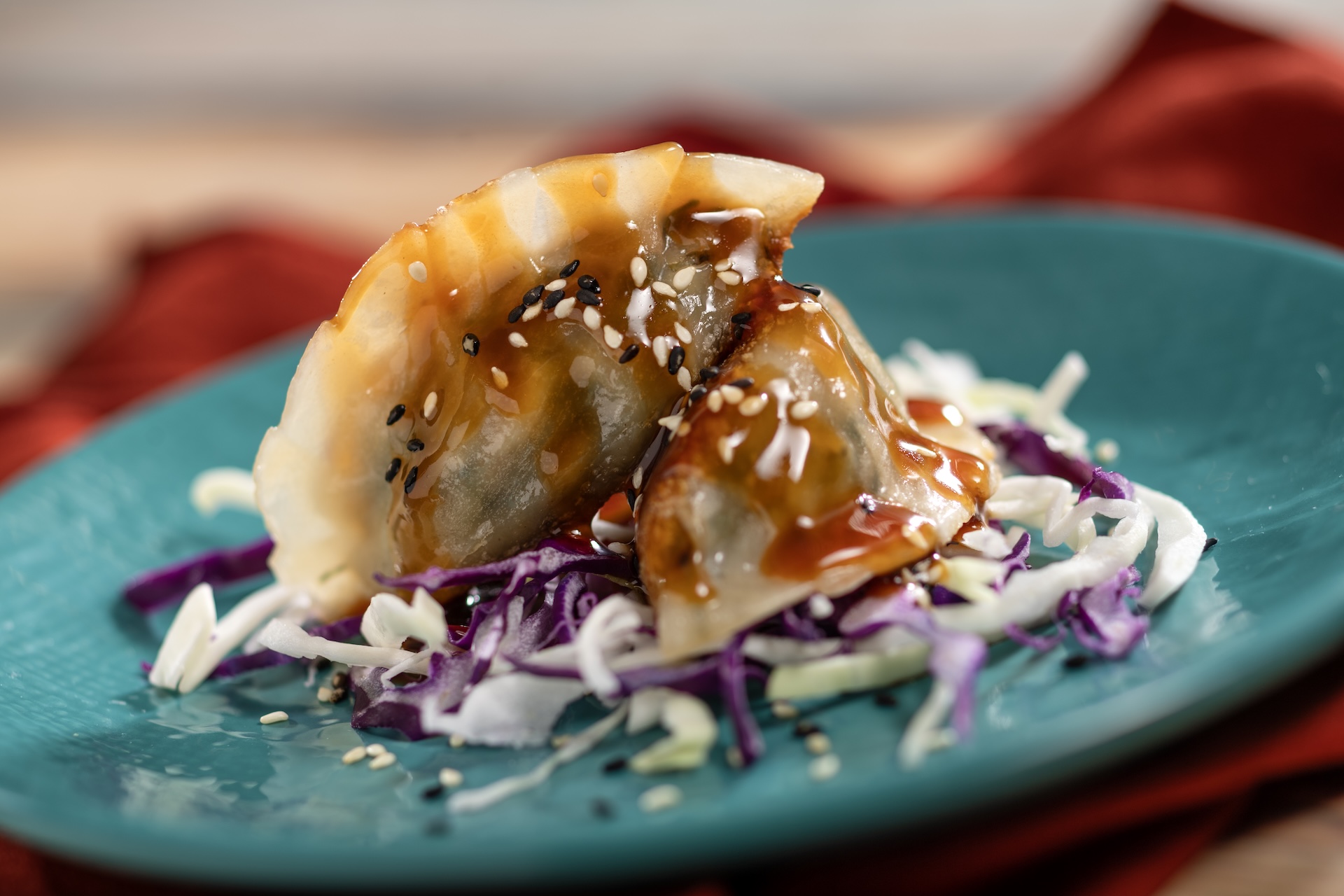 Pan-fried Vegetable Dumplings filled with bok choy, carrot, shiitake mushroom, ginger, garlic, and sesame