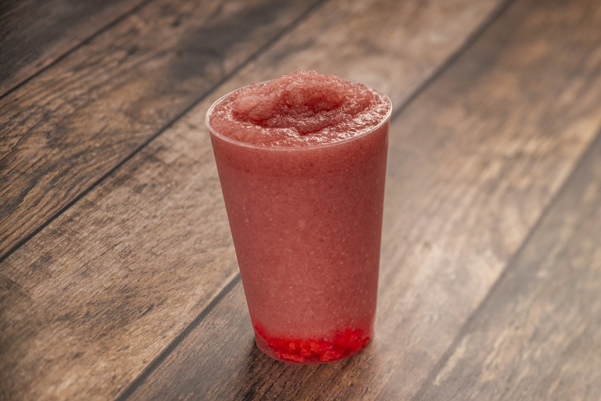 Frozen Wildberry Limeade: Minute Maid Limeade, Minute Maid Strawberry Smoothie, and wildberry syrup with popping candy (Non-alcoholic) (Spirited version available with Tito&rsquo;s Handmade Vodka) (New)
