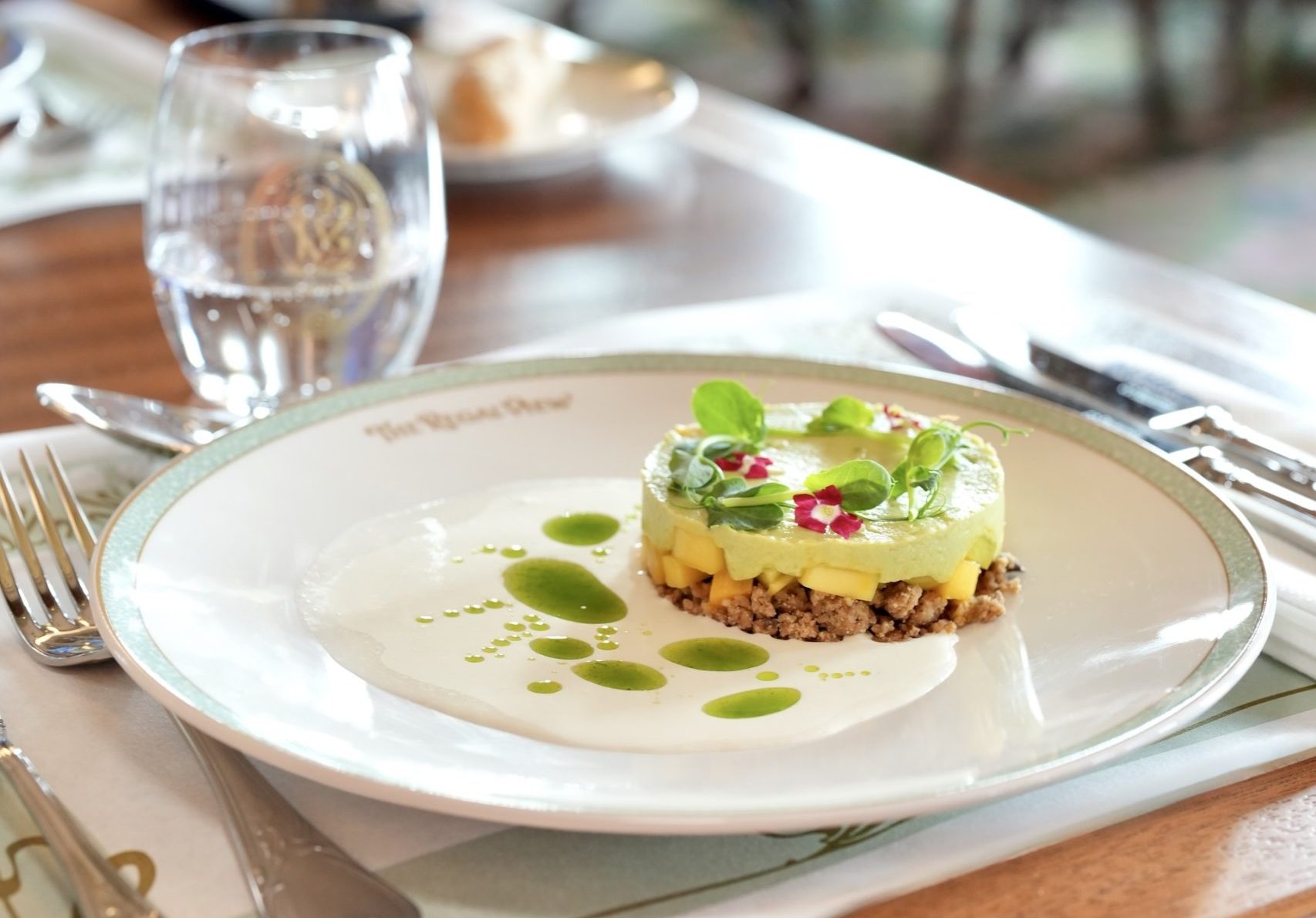 Avocado and Ginger Mousse with mango tartare and pumpkin seed crumble with creamy dill oil sauce