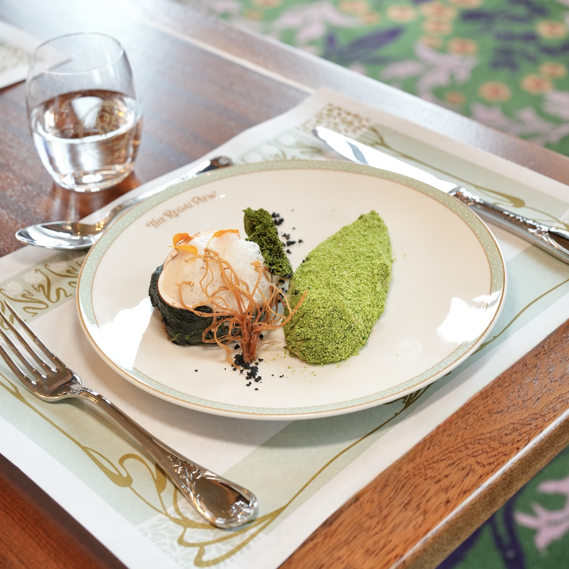 Soy and Pea Fillet with herb crust and black garlic broth, pan-fried barley with mushrooms, chard and truffle, and beer foam 