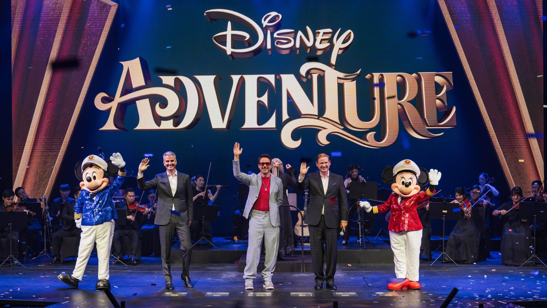 Chairman of Disney Experiences and incoming Chief Executive Officer of The Walt Disney Company, Josh D&rsquo;Amaro, President of Disney Signature Experiences, Joe Schott, the Godparent of the Disney Adventure, Robert Downey Jr., Mickey Mouse and Minnie Mouse