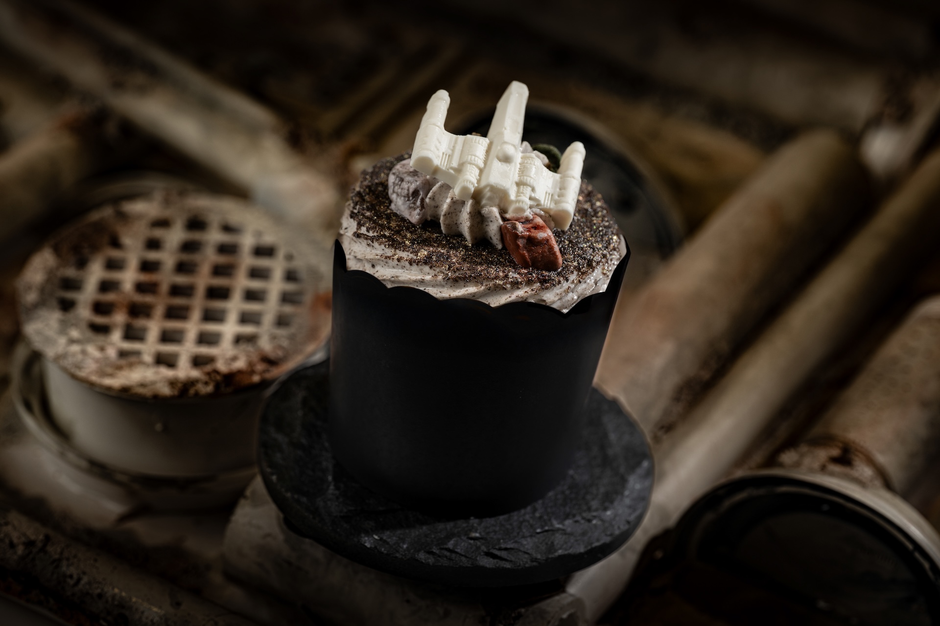 Cupcakes of your choice: Cookies & Cream Cupcakes, Marshmallow Cream, White Chocolate X-Wing, and Milk Chocolate Rocks. Inside the cupcake, a secret lightsaber color will be revealed! (new)