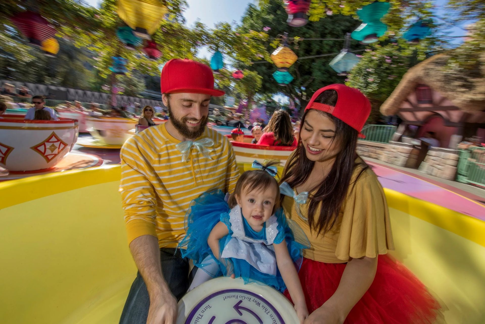 Family on Mad Tea Party at Disneyland Park