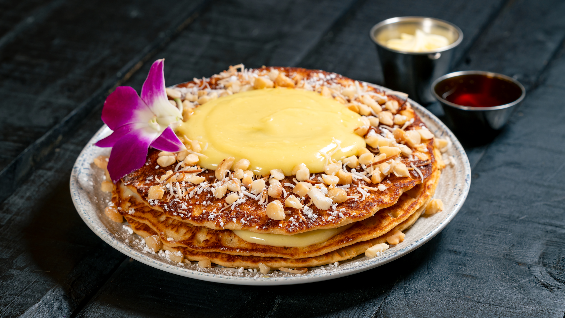Trader Sam's Enchanted Tiki Bar Disneyland Hotel Tropical Pancakes: Macadamia nut buttermilk pancakes, passion fruit curd, and toasted coconut
