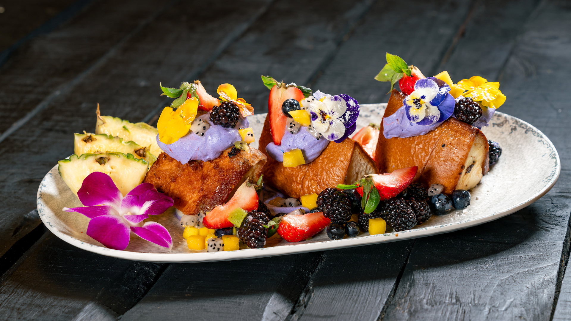 Trader Sam's Enchanted Tiki Bar Disneyland Hotel Ube-stuffed French Toast: Japanese milk bread, coconut custard, ube diplomat cream, and fresh tropical fruit