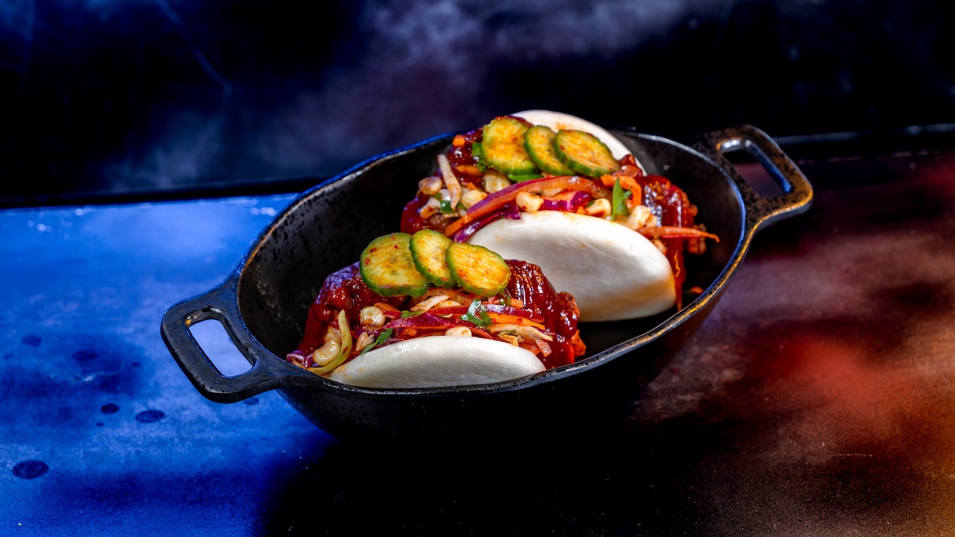 Fried Chicken Baos with sweet chili sauce, scallion salad, and cucumber coins