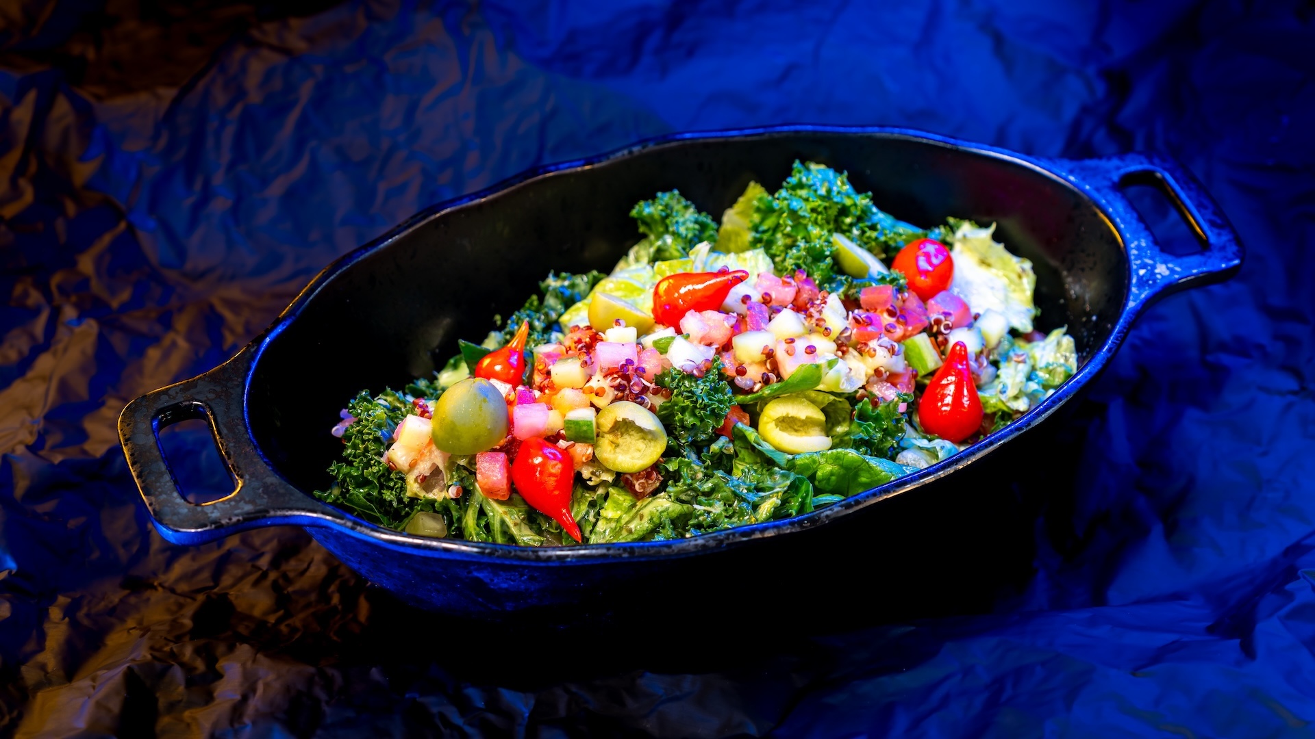 Surabat Valley Greens Salad with quinoa-veggie mix, mini peppers, olives, and cilantro dressing (Plant-based)