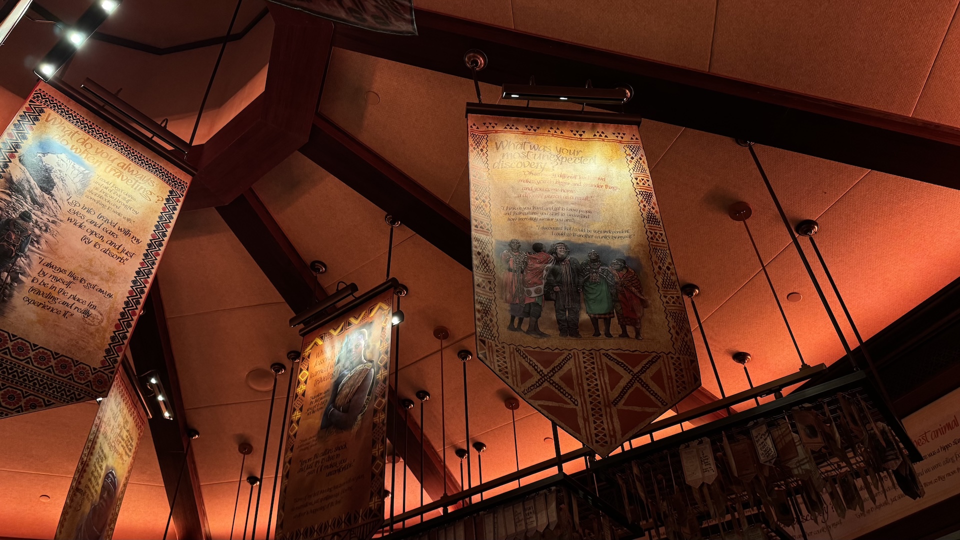 Decorative banners hang from the ceiling in a warmly lit restaurant.