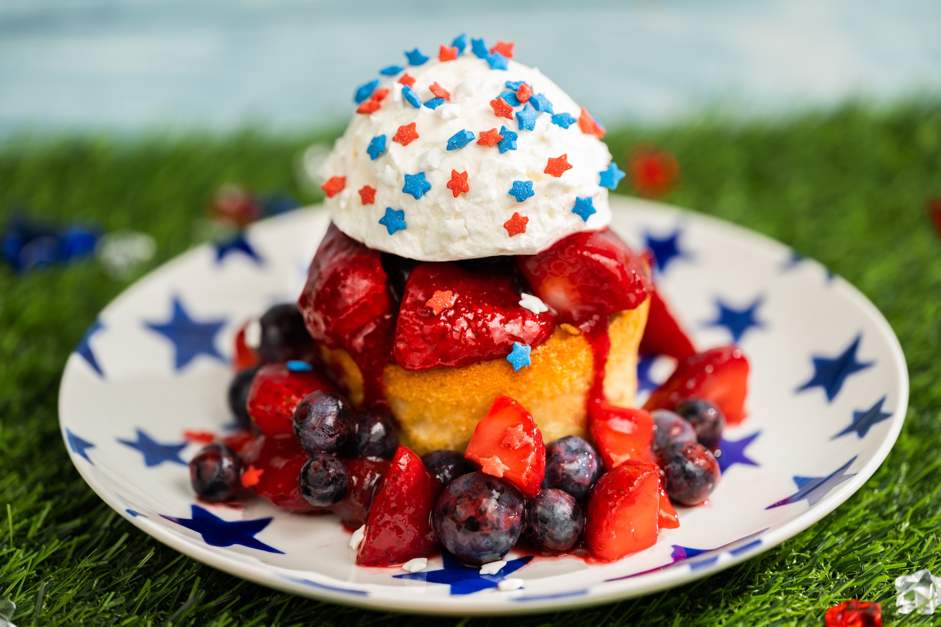 Disney Parks America 250 Foodie Guide Berry Shortcake: Shortcake topped with mixed berries, whipped cream, and patriotic sprinkles