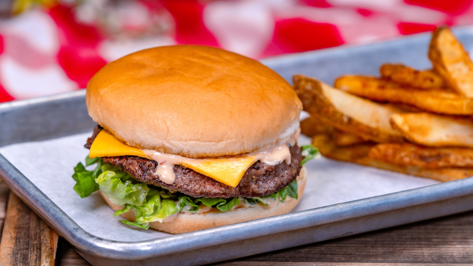 Disney Parks America 250 Foodie Guide Classic Cheeseburger with beer-battered fries
