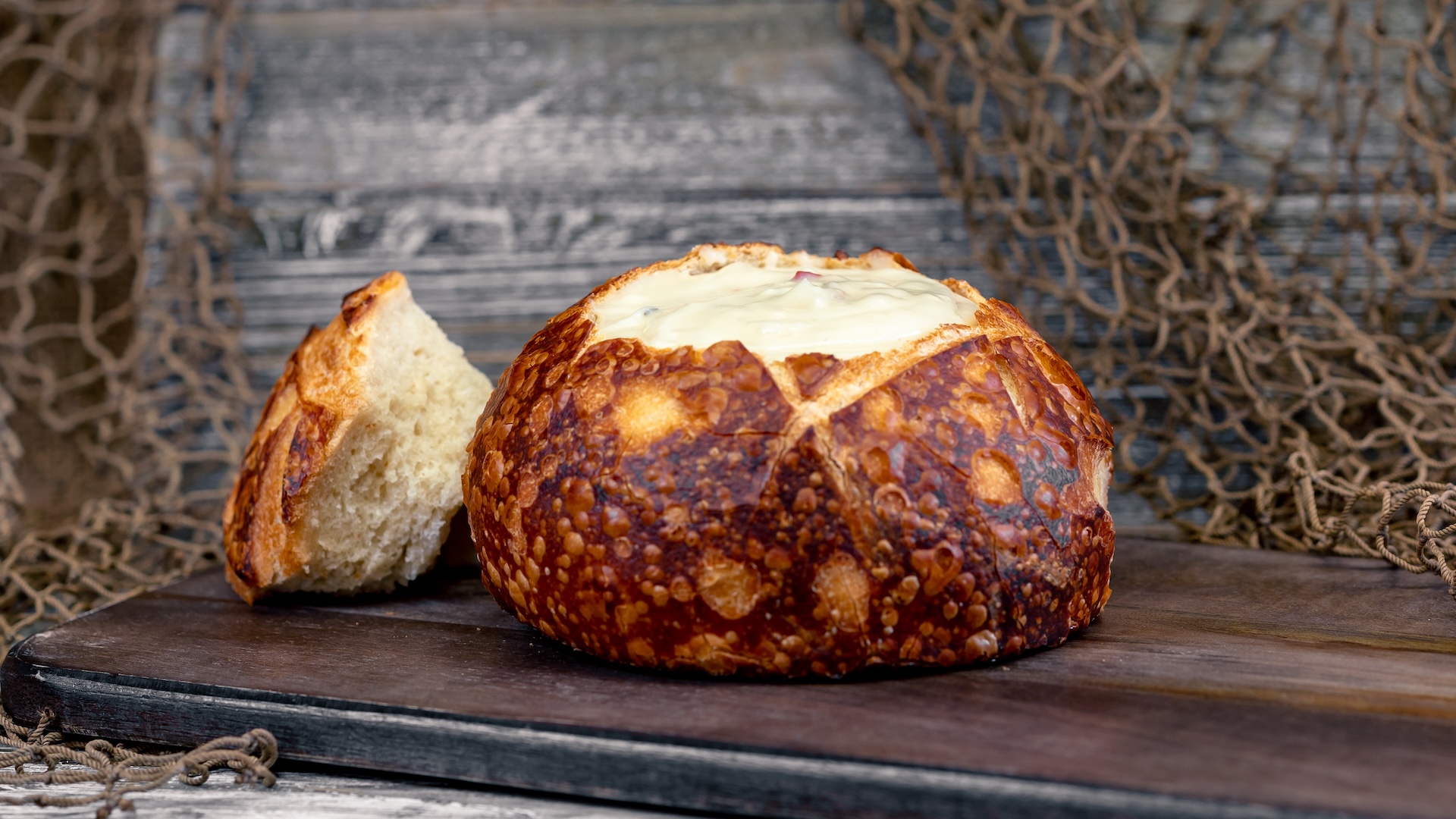 Disney Parks America 250 Foodie Guide Clam Chowder in a Sourdough Bread Bowl
