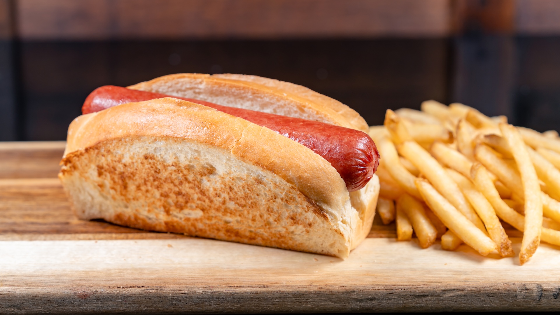 Disney Parks America 250 Foodie Guide All-Beef Hot Dog served on a toasted bun with Cuties Mandarin Oranges or fries