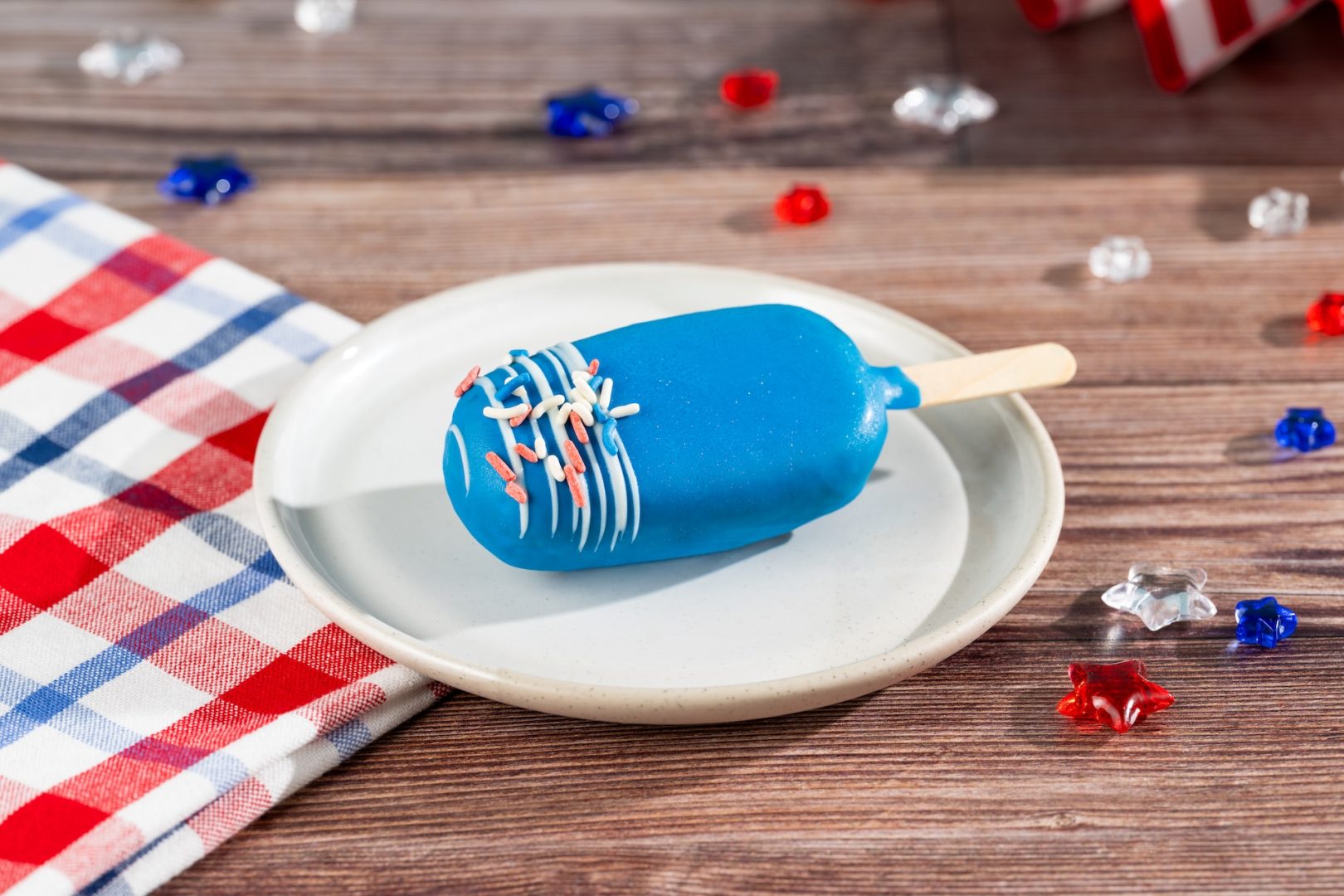 Disney Parks America 250 Foodie Guide Red, White, and Blue Cake Pop: Blueberry and vanilla swirl cheesecake (New);