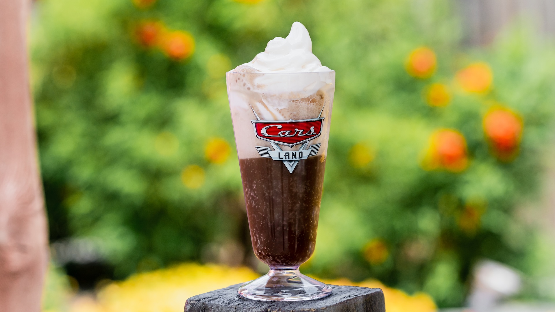 Disney Parks America 250 Foodie Guide Ice Cream Float: Two scoops of vanilla ice cream served with choice of Barq's Root Beer, Fanta Orange, or Coca-Cola (Non-alcoholic)