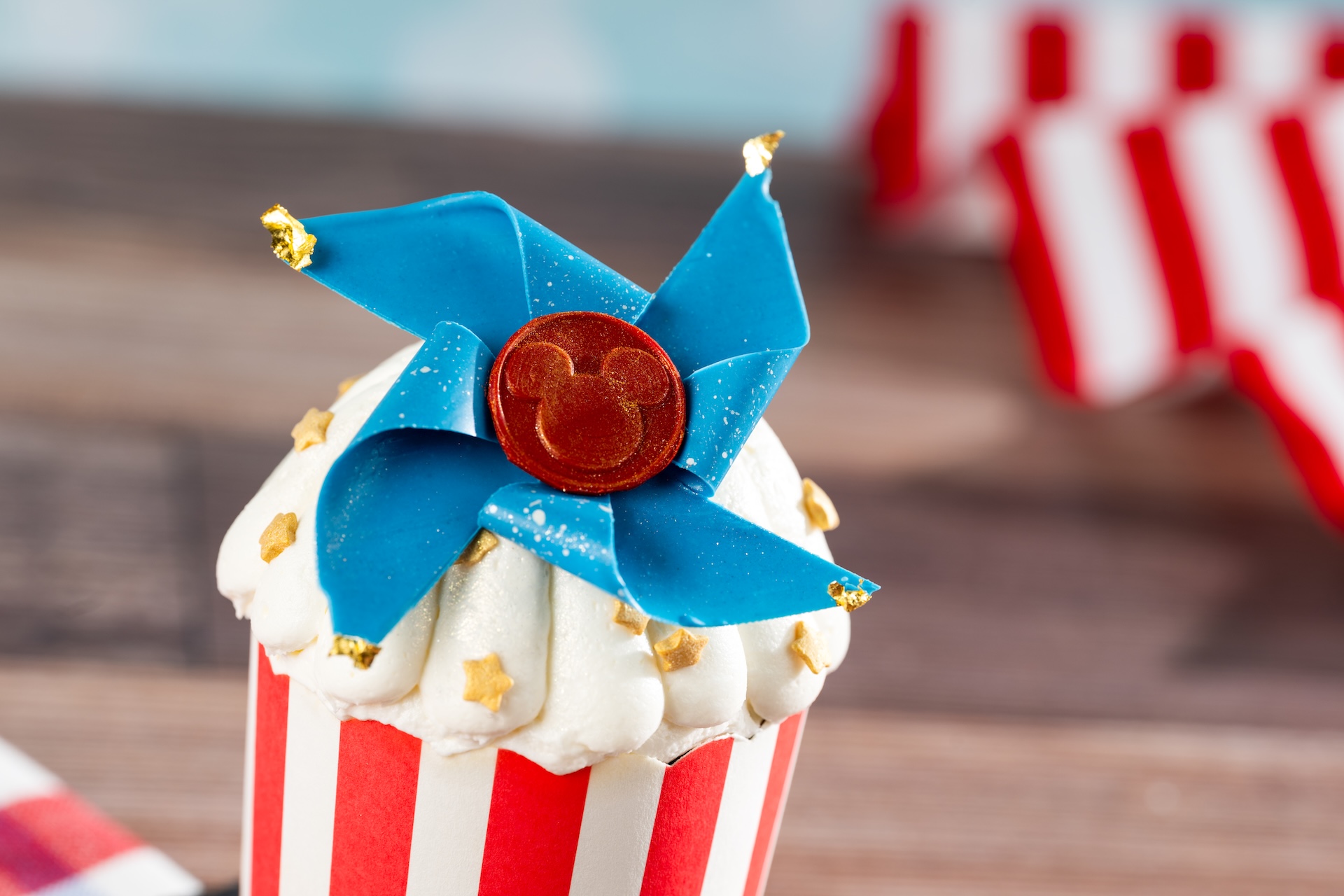 Disney Parks America 250 Foodie Guide Strawberry Shortcake Cupcake: Vanilla sponge, strawberry filling, chantilly cream, and white chocolate pinwheel (New);