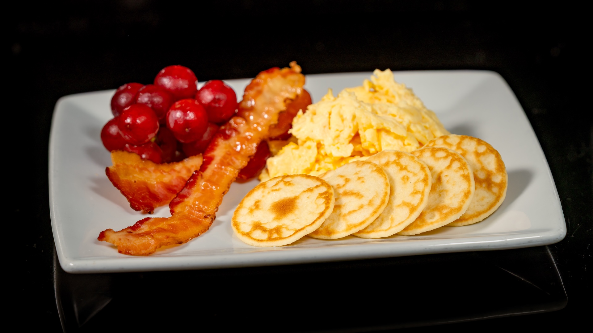 Disneyland Kids Meals Mini Meteor Pancake Kids Meal: Eggs, bacon, mini pancakes, seasonal fruit, and choice of small DASANI Water or small lowfat milk (only available during breakfast)