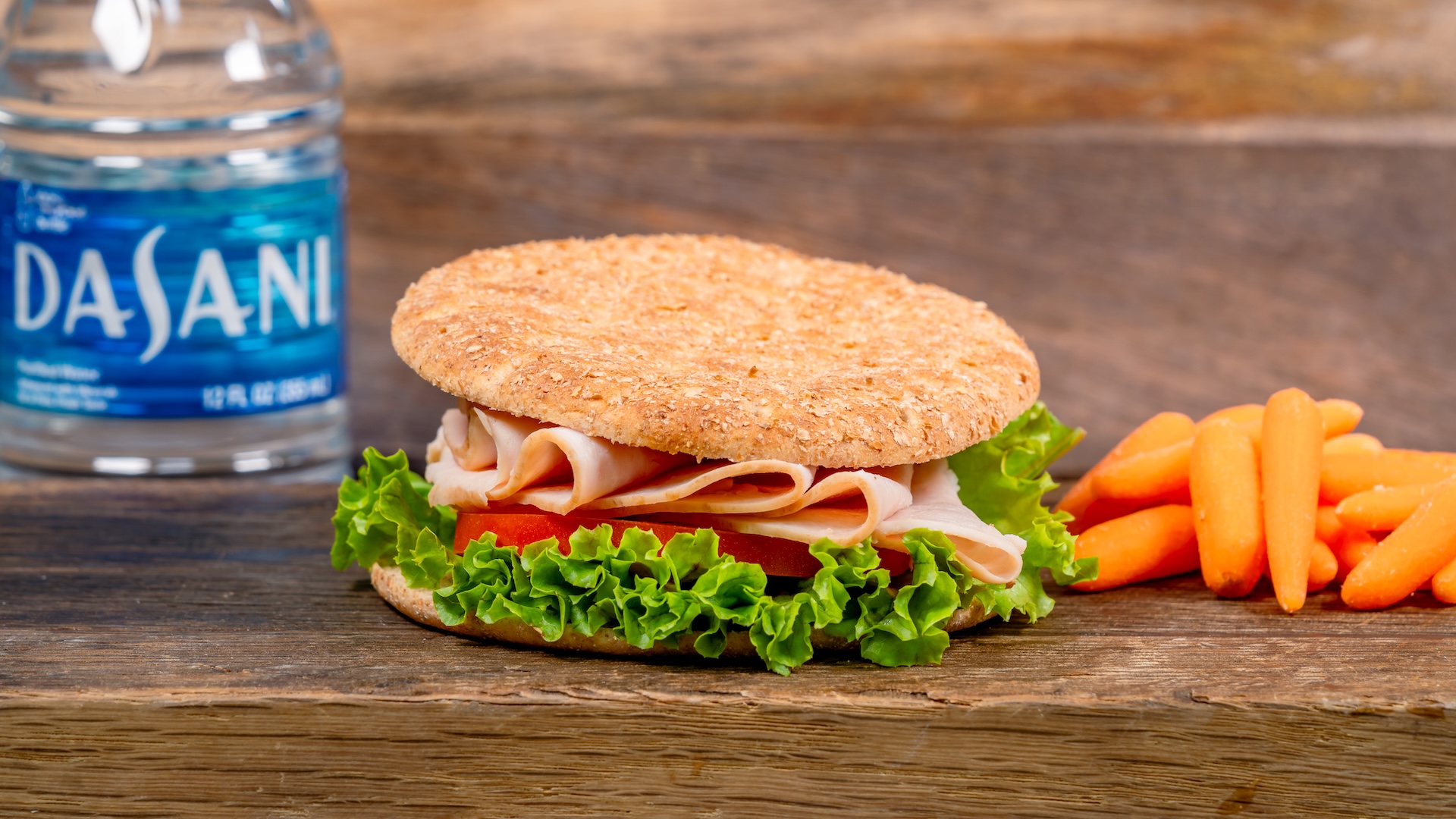 Disneyland Kids Meals Turkey Sandwich served with applesauce, carrots, and choice of small lowfat milk or small DASANI Water (gluten/wheat allergy-friendly and milk allergy-friendly options also available)