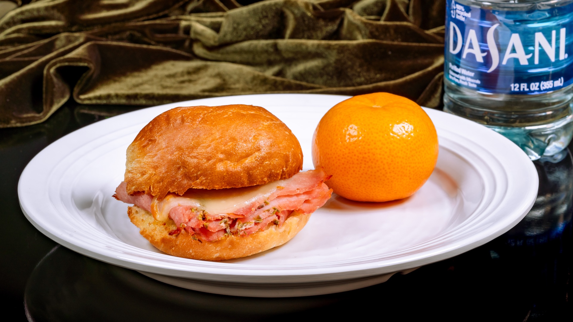 Disneyland Kids Meals Toasted Ham & Cheese Sandwich: Savory ham and provolone served with a Cuties Mandarin Orange and applesauce with choice of small DASANI Water or small lowfat milk (sesame allergy-friendly option also available)
