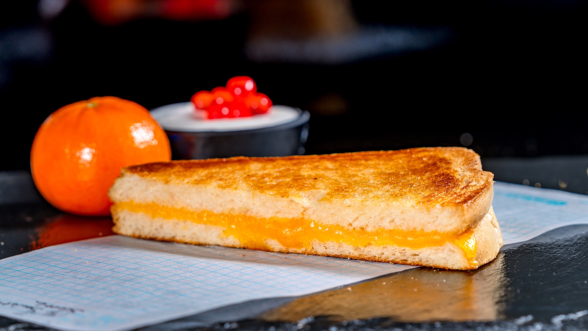 Disneyland Kids Meals Bite-sized Grilled Cheese: Melted cheddar on toasted sourdough served with a Cuties Mandarin Orange, yogurt, and choice of small DASANI Water or small lowfat milk