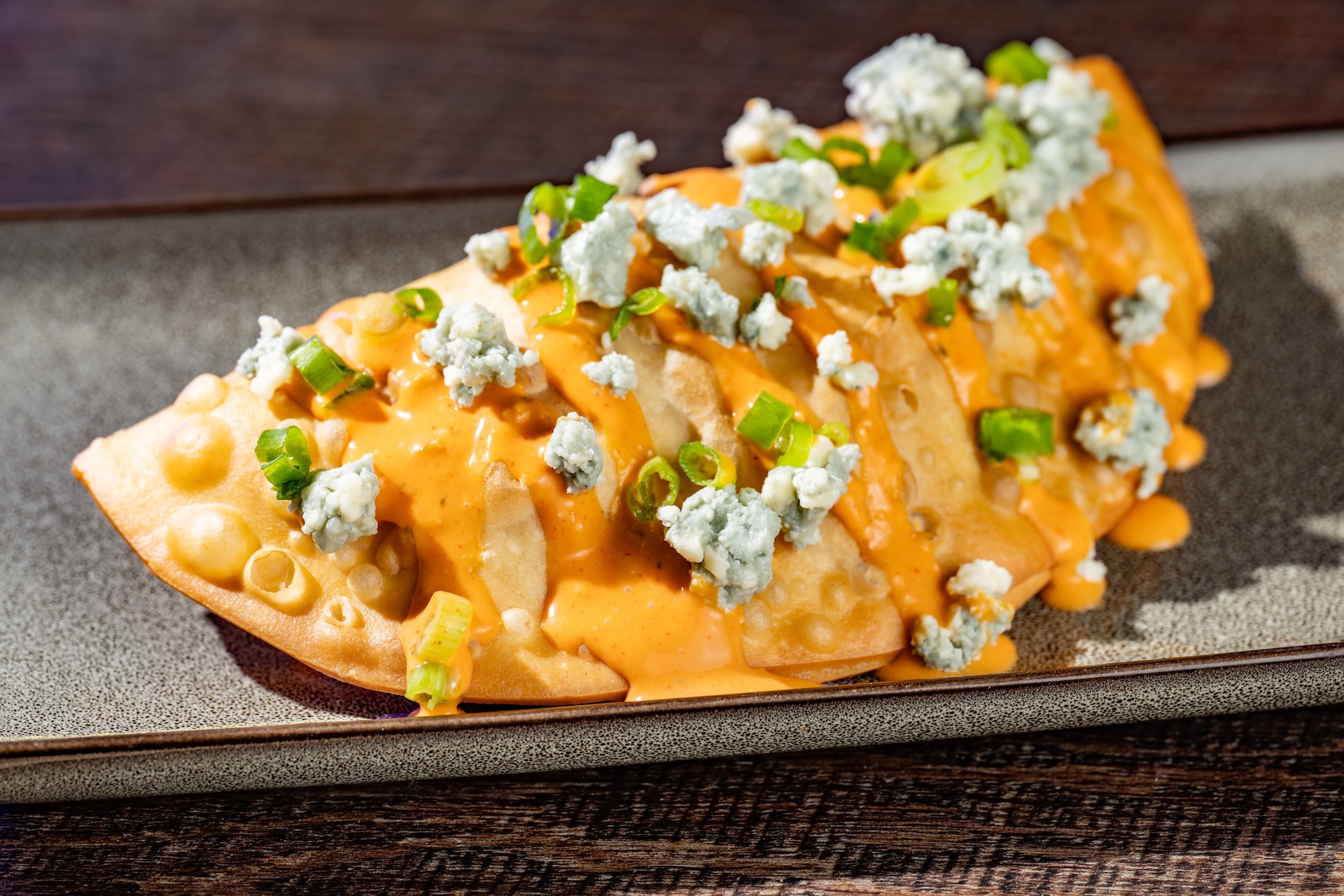 Buffalo Chicken Hand Pie: Buffalo chicken and mozzarella wrapped in a flaky dough topped with blue cheese crumbles and Buffalo-ranch (Available during Mickey&rsquo;s Not-So-Scary Halloween Party only)