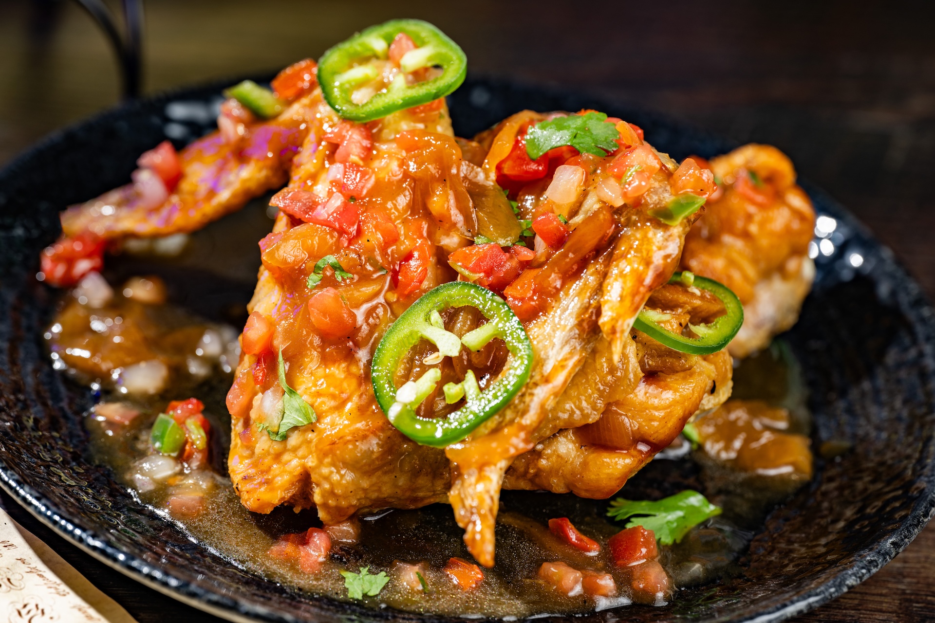 Buzzard Wings: Whole chicken wings tossed with grilled onions, jalape&ntilde;os, and lime (Available during Mickey&rsquo;s Not-So-Scary Halloween Party only)