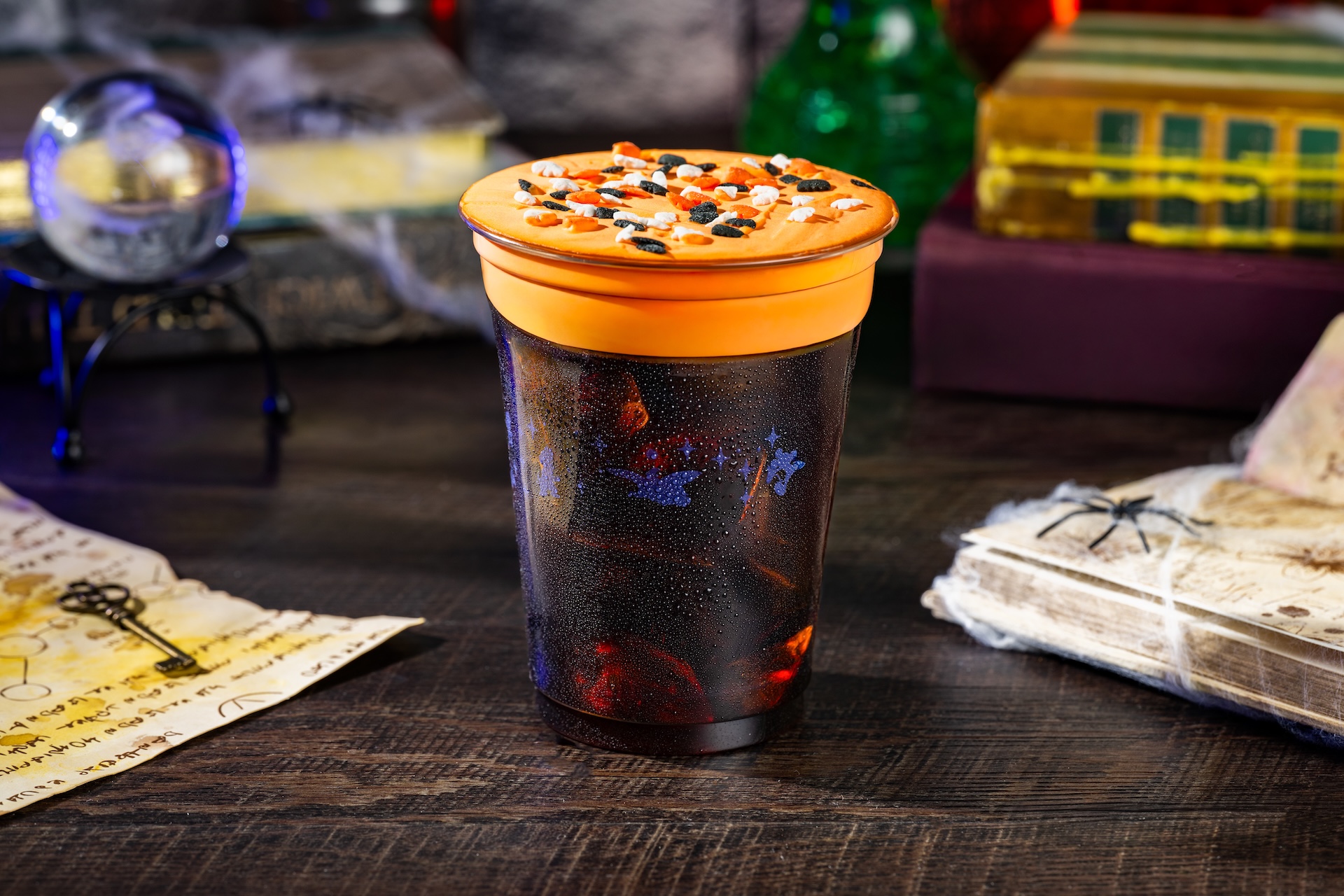 Cauldron Cold Brew: Joffrey&rsquo;s Cold Brew Coffee with pumpkin-spiced foam and Halloween sprinkles (Non-alcoholic) (Available during regular park hours and Mickey&rsquo;s Not-So-Scary Halloween Party)