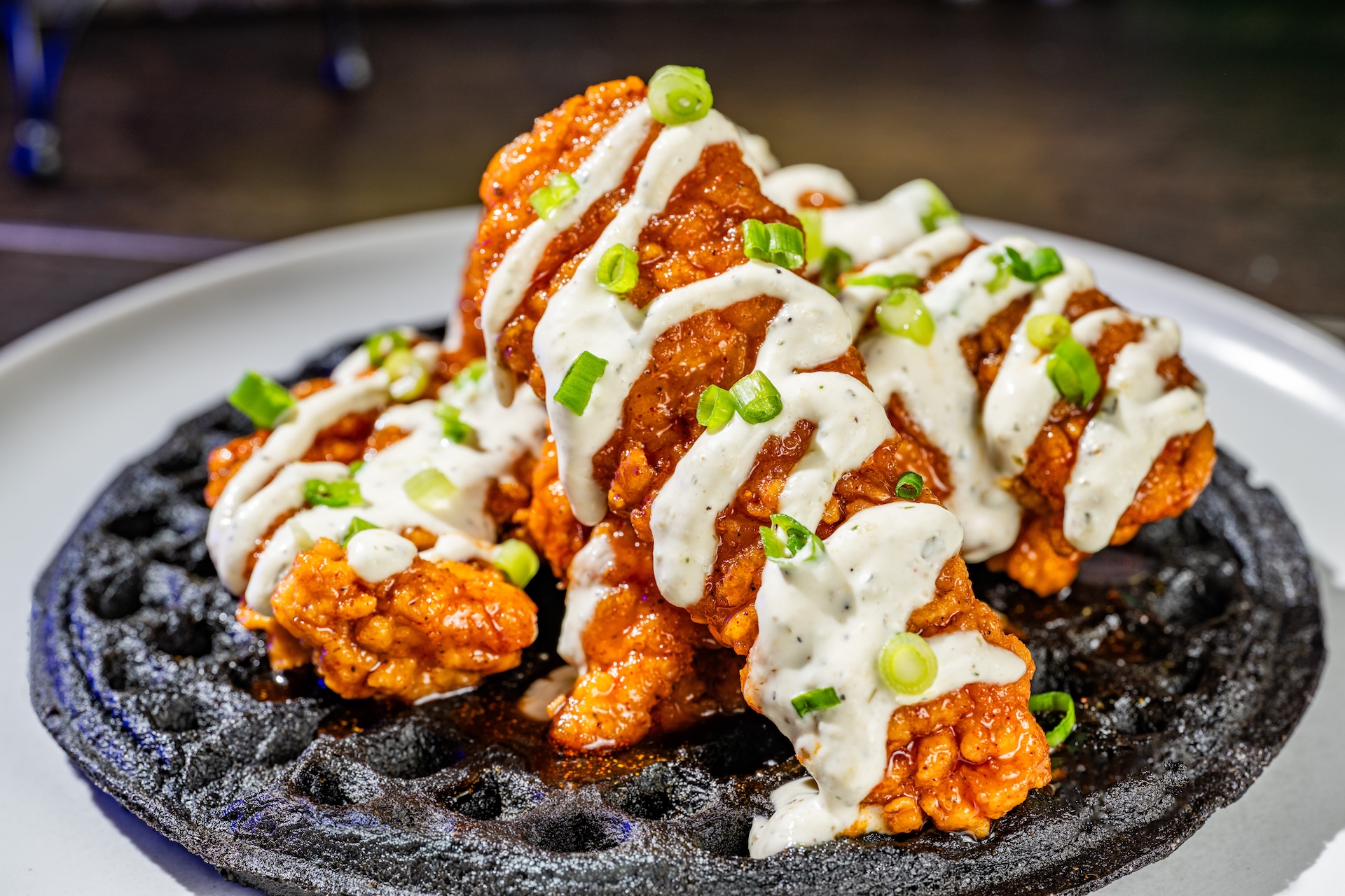 Graveyard Hot Chicken and Waffle: Nashville hot chicken strips, blue cornmeal waffle, and pickle ranch (New) (Available during Mickey&rsquo;s Not-So-Scary Halloween Party only)