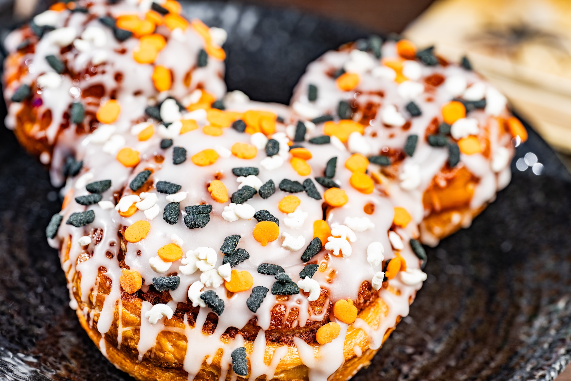 Mickey Cinnamon Roll with white icing and Halloween sprinkles (Available during Mickey&rsquo;s Not-So-Scary Halloween Party only)