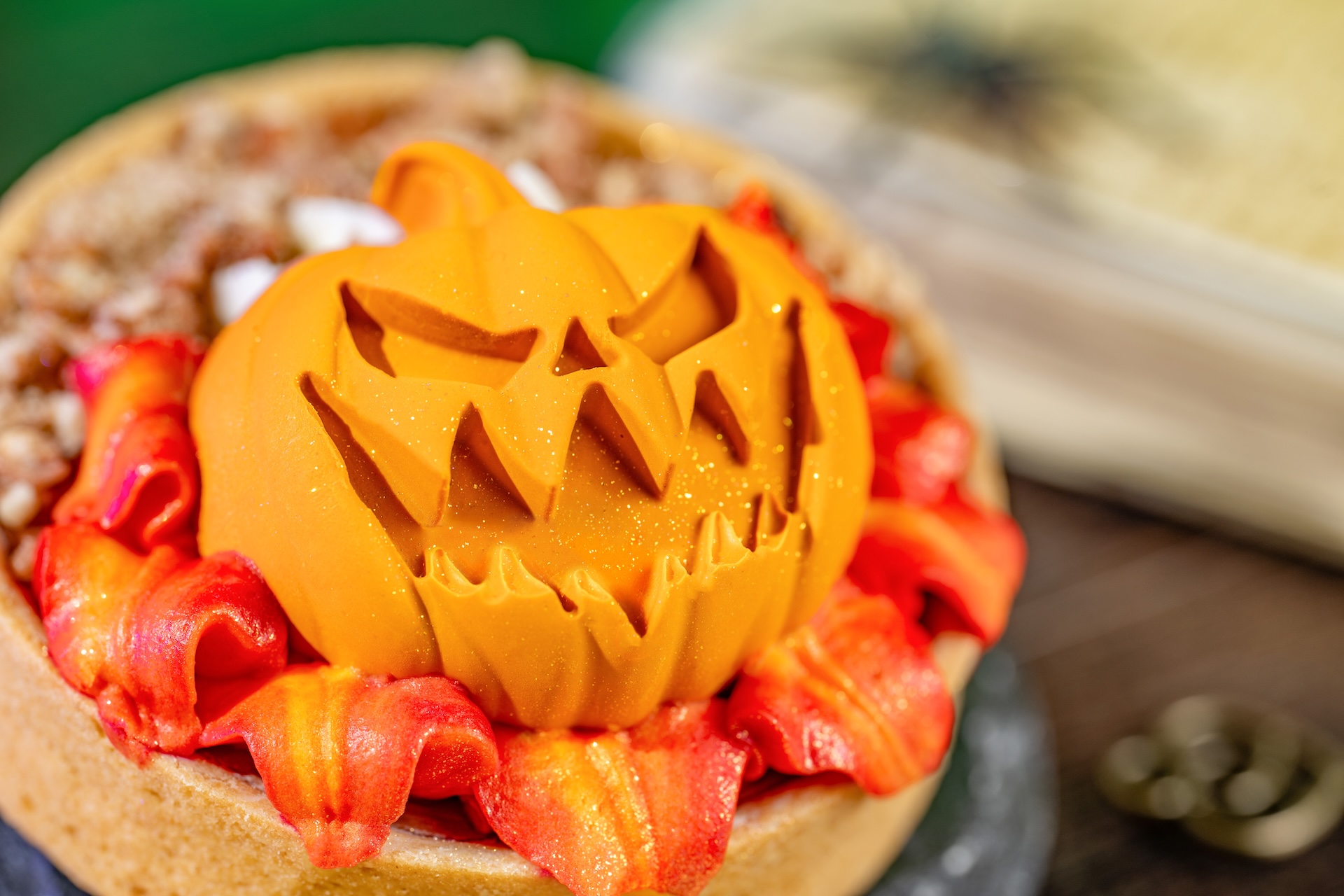 Headless Horseman Treat: Pumpkin pie tart topped with whipped cheesecake, spiced caramel panna cotta, candied pecans, and marshmallow buttercream &ldquo;flames&rdquo; (New) (Available during Mickey&rsquo;s Not-So-Scary Halloween Party only)