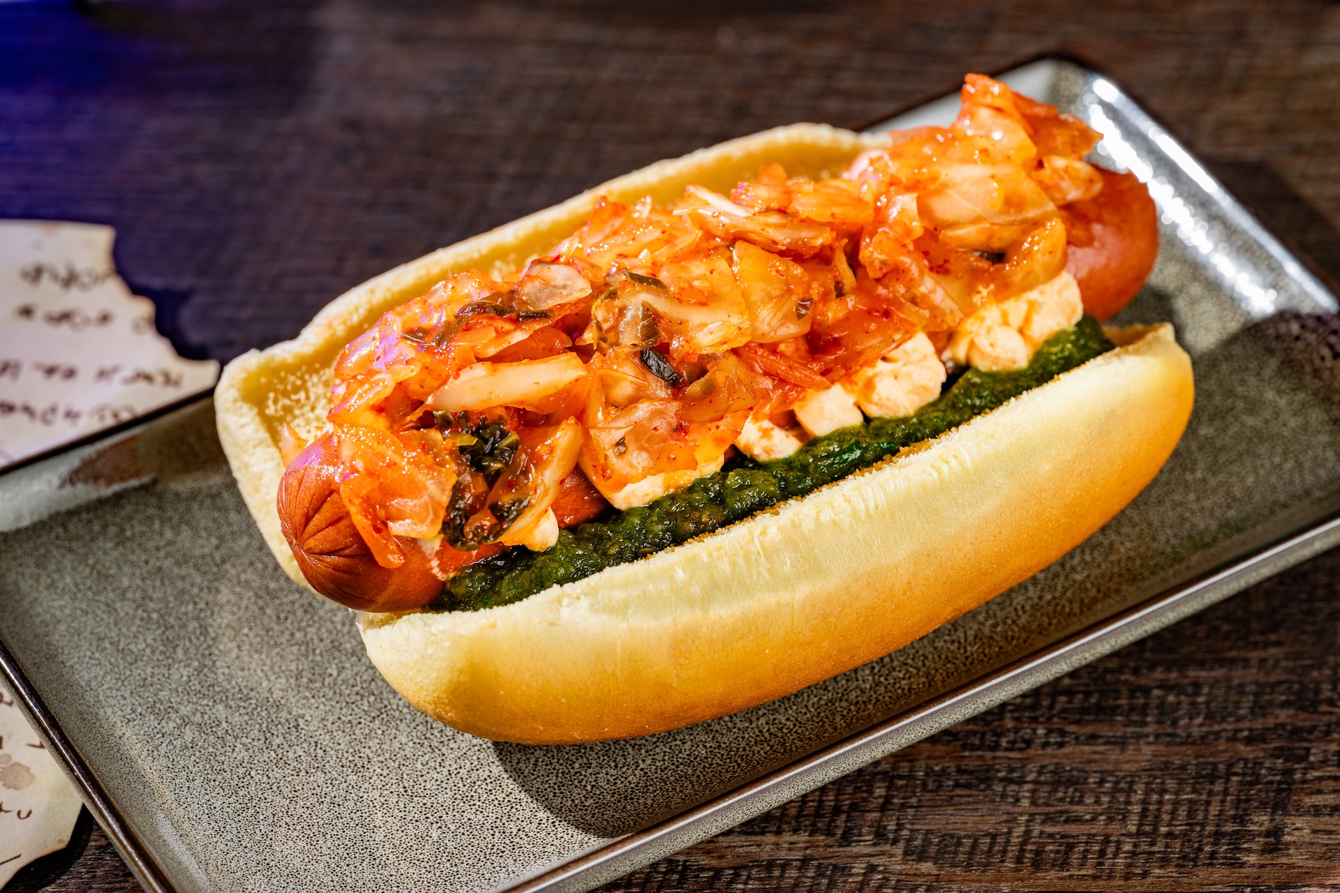Creepy Kimchi Hot Dog topped with sriracha cream cheese, kimchi, and Hades relish (Available during Mickey&rsquo;s Not-So-Scary Halloween Party only)